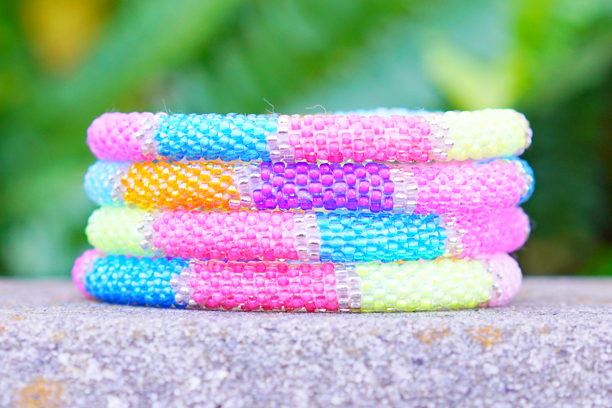 Handmade glass bead bracelet from Nepal, featuring a roll design. Also known as a beaded bracelet, seed bead bracelet, beach glass bracelet, or sea glass bracelet.