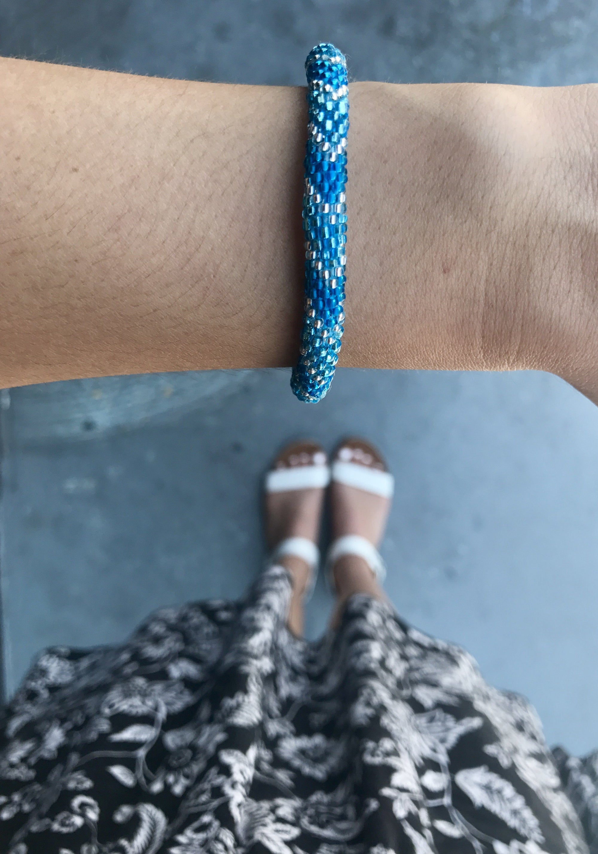 Handmade glass bead bracelet from Nepal, featuring a roll design. Also known as a beaded bracelet, seed bead bracelet, beach glass bracelet, or sea glass bracelet.