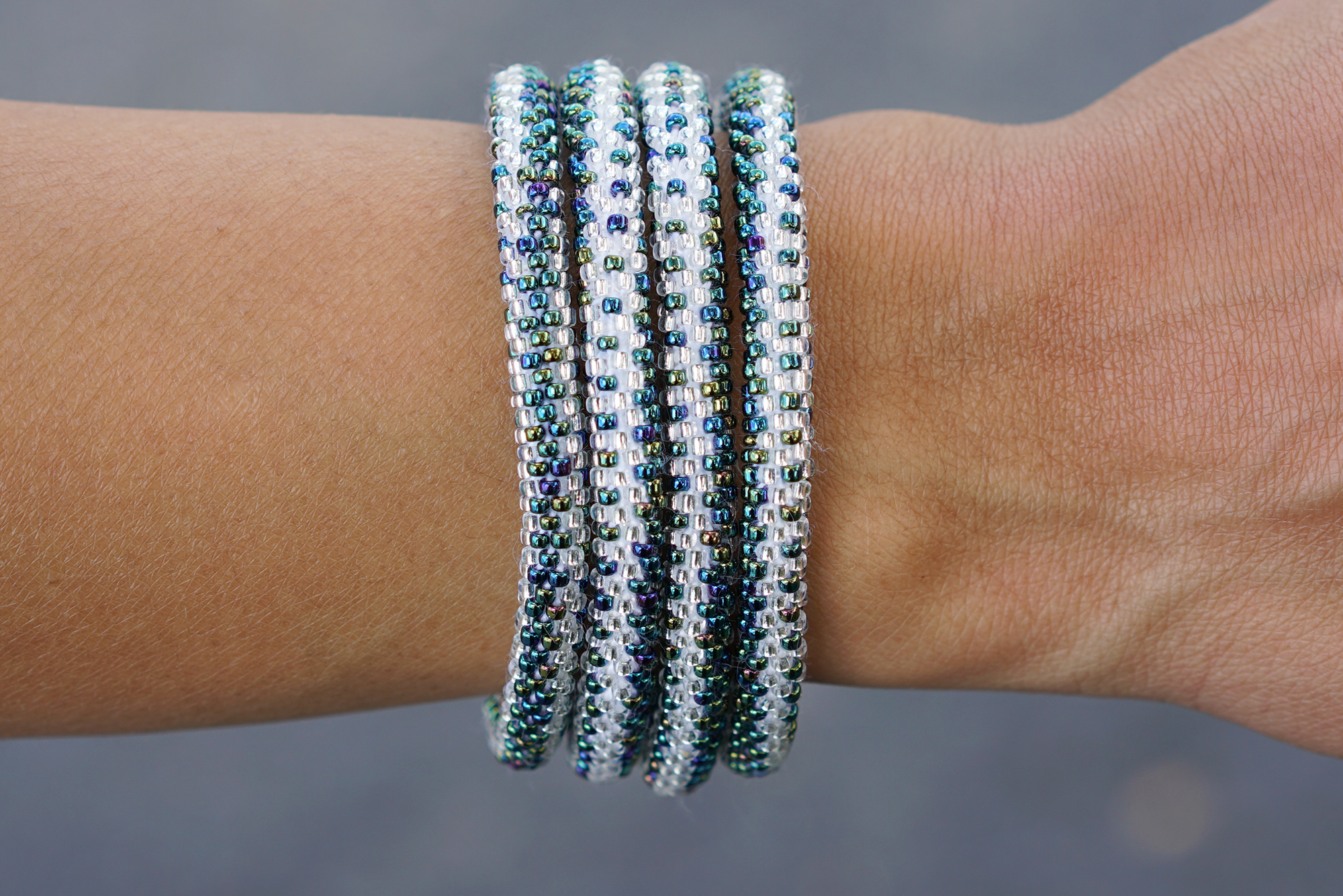 Handmade glass bead bracelet from Nepal, featuring a roll design. Also known as a beaded bracelet, seed bead bracelet, beach glass bracelet, or sea glass bracelet.