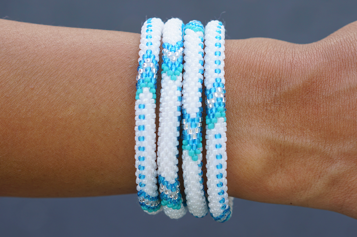 Handmade glass bead bracelet from Nepal, featuring a roll design. Also known as a beaded bracelet, seed bead bracelet, beach glass bracelet, or sea glass bracelet.