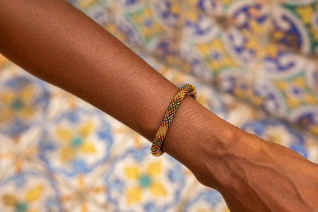 Handmade glass bead bracelet from Nepal, featuring a roll design. Also known as a beaded bracelet, seed bead bracelet, beach glass bracelet, or sea glass bracelet