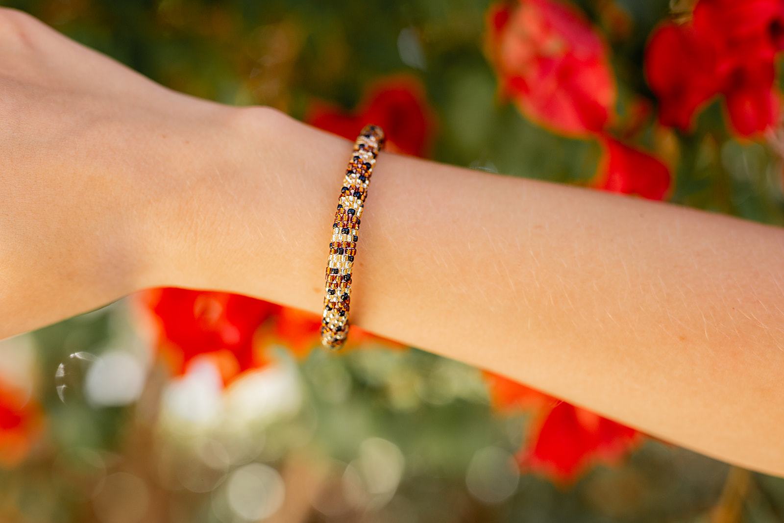 Handmade glass bead bracelet from Nepal, featuring a roll design. Also known as a beaded bracelet, seed bead bracelet, beach glass bracelet, or sea glass bracelet.