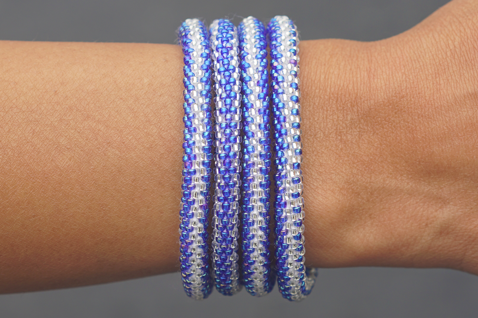 Handmade glass bead bracelet from Nepal, featuring a roll design. Also known as a beaded bracelet, seed bead bracelet, beach glass bracelet, or sea glass bracelet.