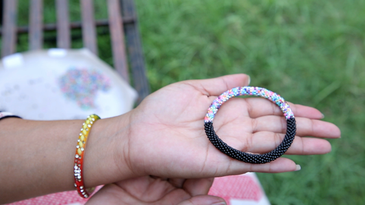 Handmade glass bead bracelet from Nepal, featuring a roll design. Also known as a beaded bracelet, seed bead bracelet, beach glass bracelet, or sea glass bracelet.