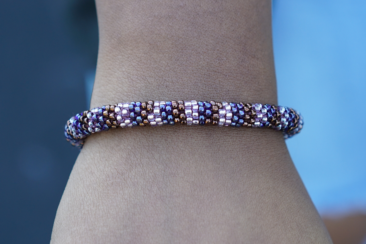 Handmade glass bead bracelet from Nepal, featuring a roll design. Also known as a beaded bracelet, seed bead bracelet, beach glass bracelet, or sea glass bracelet.