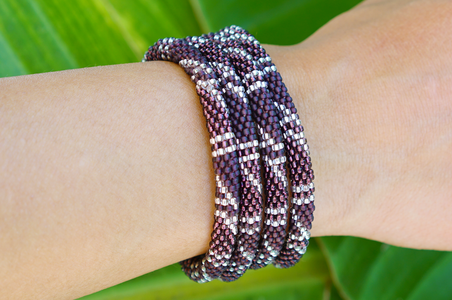 Handmade glass bead bracelet from Nepal, featuring a roll design. Also known as a beaded bracelet, seed bead bracelet, beach glass bracelet, or sea glass bracelet.