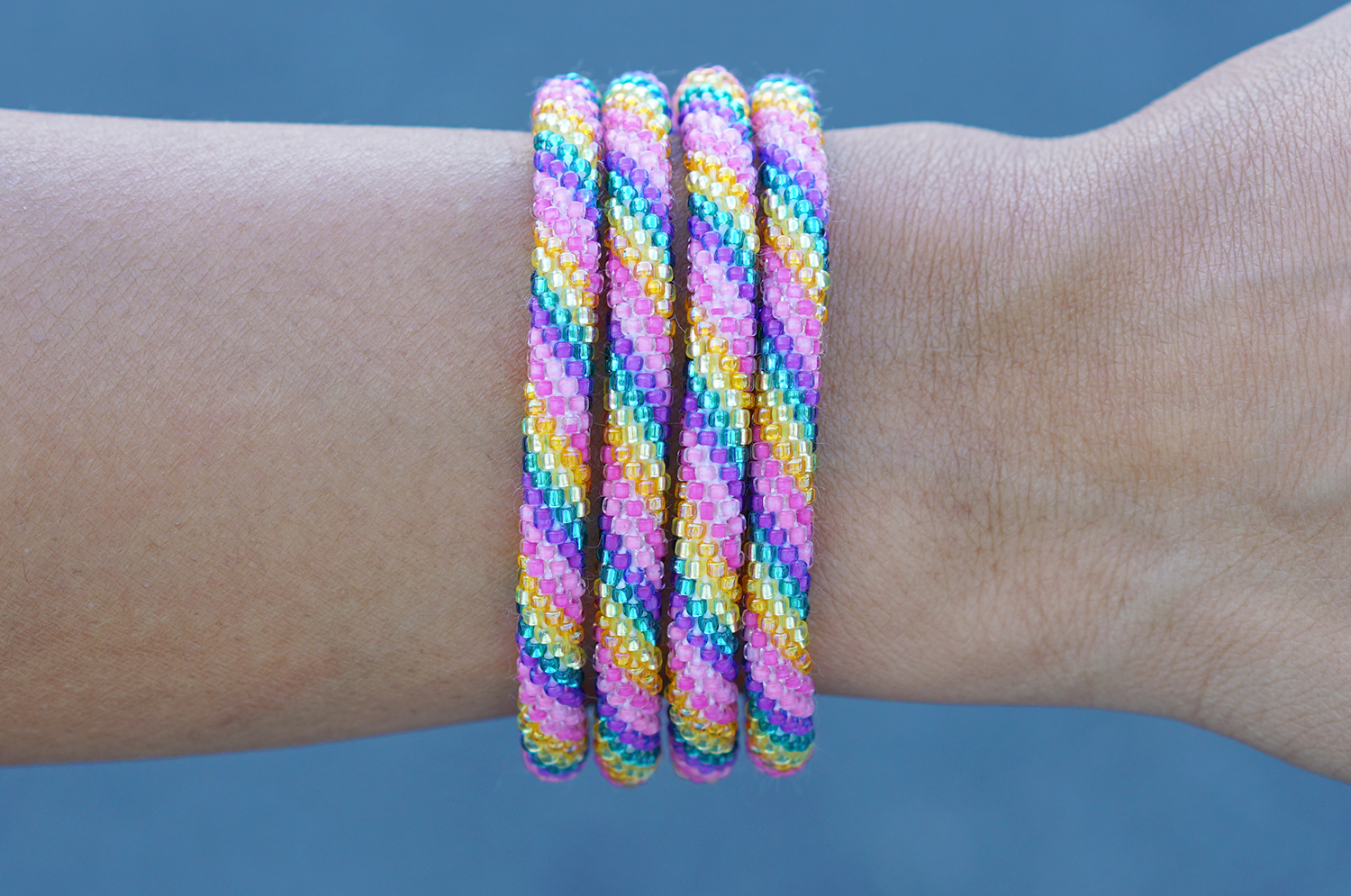 Handmade glass bead bracelet from Nepal, featuring a roll design. Also known as a beaded bracelet, seed bead bracelet, beach glass bracelet, or sea glass bracelet.