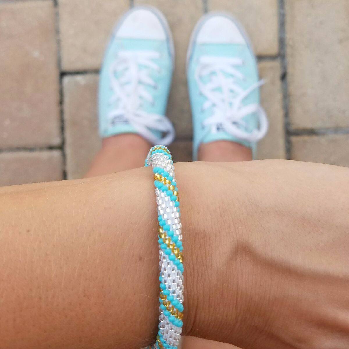 Handmade glass bead bracelet from Nepal, featuring a roll design. Also known as a beaded bracelet, seed bead bracelet, beach glass bracelet, or sea glass bracelet.