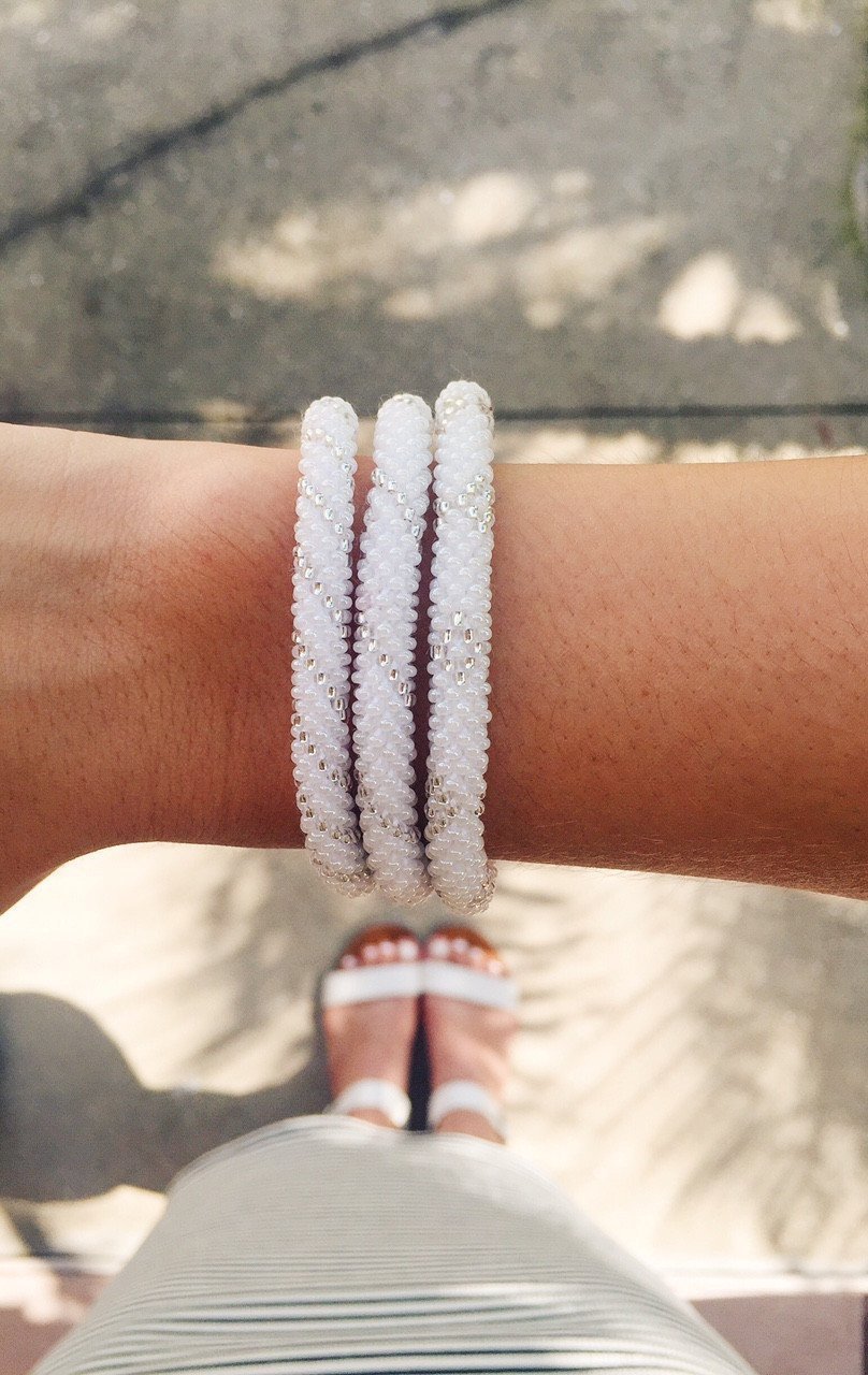 Handmade glass bead bracelet from Nepal, featuring a roll design. Also known as a beaded bracelet, seed bead bracelet, beach glass bracelet, or sea glass bracelet.