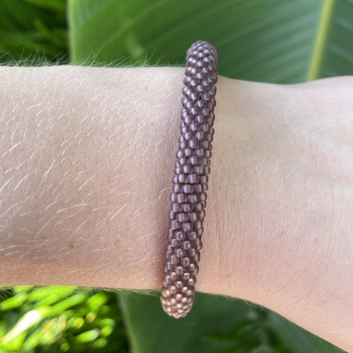 Handmade glass bead bracelet from Nepal, featuring a roll design. Also known as a beaded bracelet, seed bead bracelet, beach glass bracelet, or sea glass bracelet